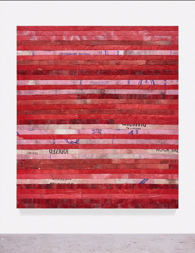 Hugo McCloud. red line to Bataan, 2016. Used polyethylene sacks mounted to panel, 86 x 78 in (218.4 x 198.1 cm). © Hugo McCloud, courtesy: Sean Kelly, New York.