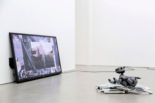 Yuri Pattison. Aibo Overcoming Modernity, 2014. Programmed Sony AIBO (Artificial Intelligence Robot, homonymous with aibō, (pal or partner in Japanese) entertainment robot, static cling sticker, inflight magazines.